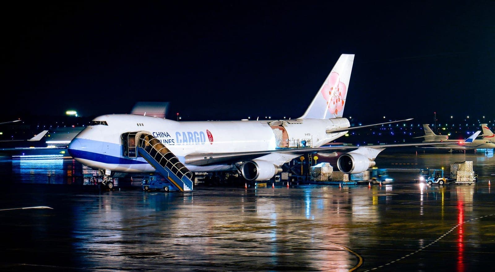 Cargo 747 freighter on the airport ramp at night