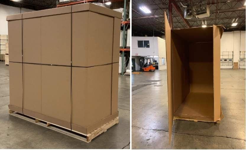 Two cardboard lift vans at the warehouse — one strapped shut, one open and empty