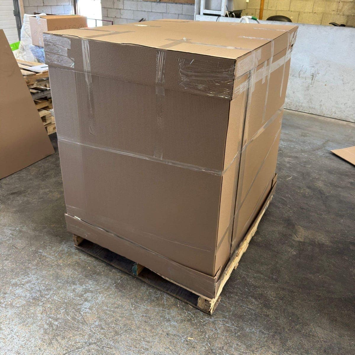 Large palletized carton taped and strapped, ready for export consolidation