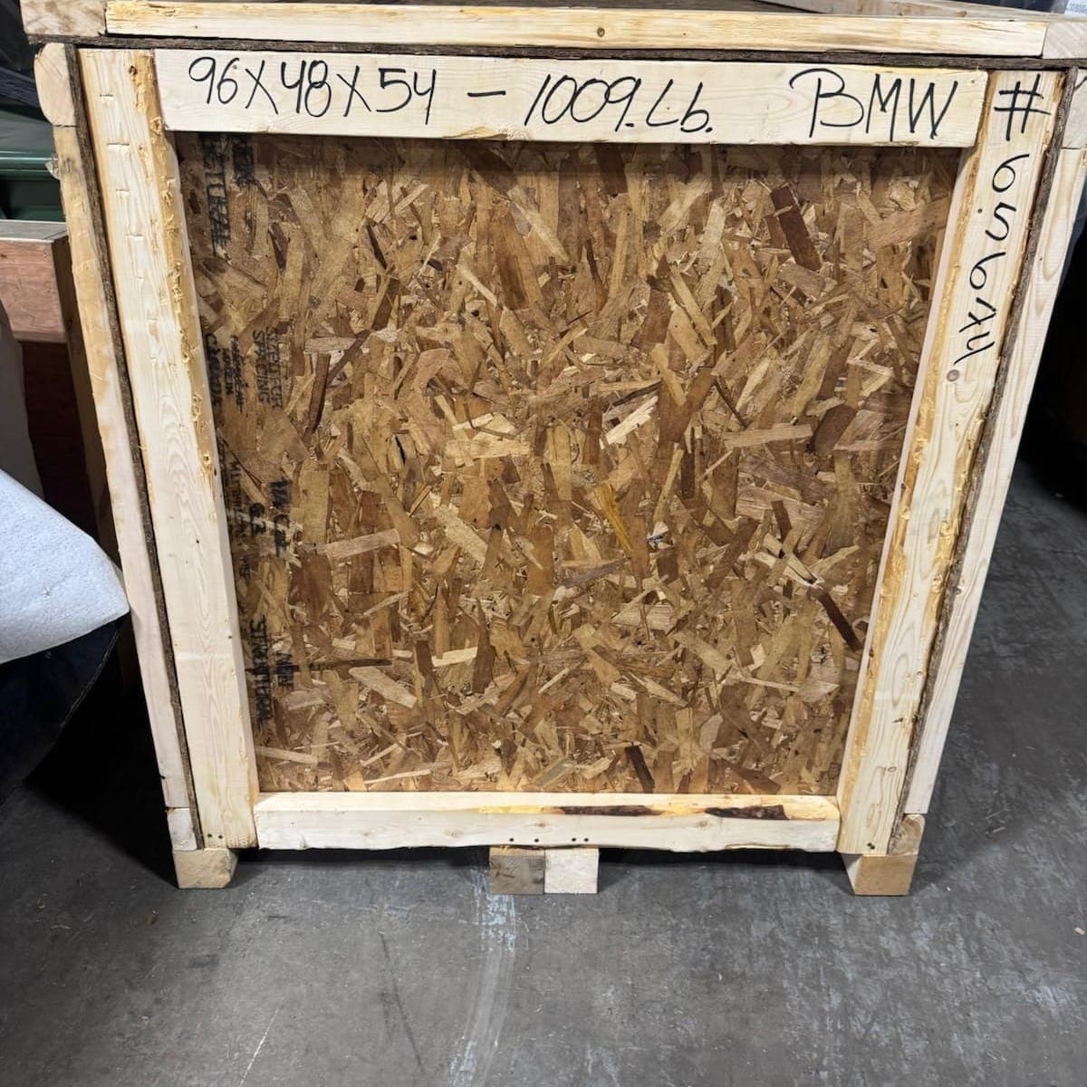 Finished motorcycle crate marked with dimensions and weight, ready to ship
