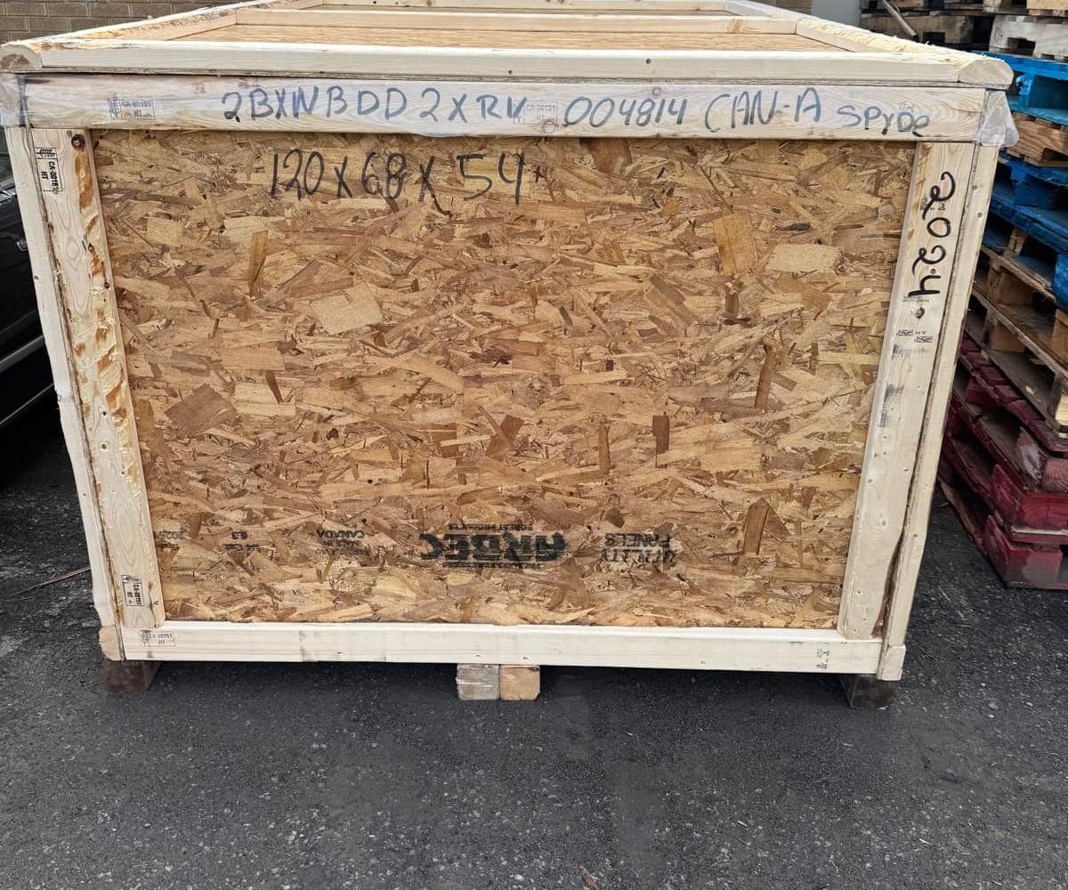 Finished heat-treated motorcycle crate with dimensions marked, ready to load