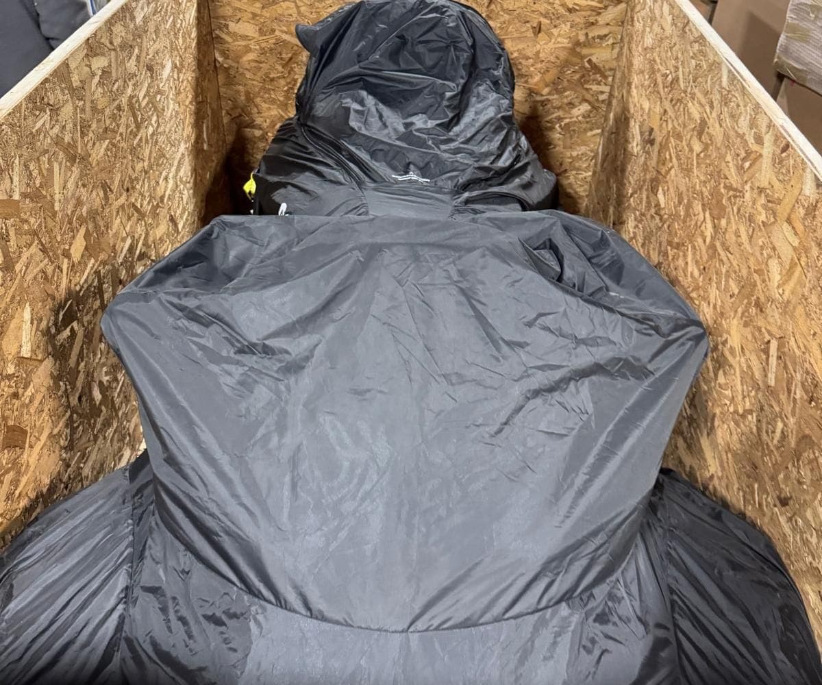 Covered motorcycle inside the crate as the plywood walls go up